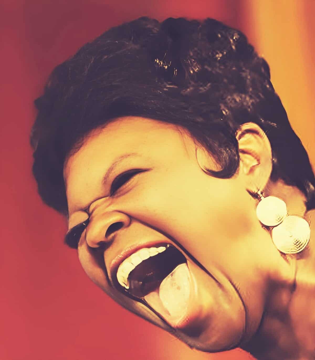 Portrait of a joyful woman laughing, showcasing expressive emotions, in a vibrant red background, emphasizing happiness, music, and lively moments; perfect for nostalgia and sound archive themes.