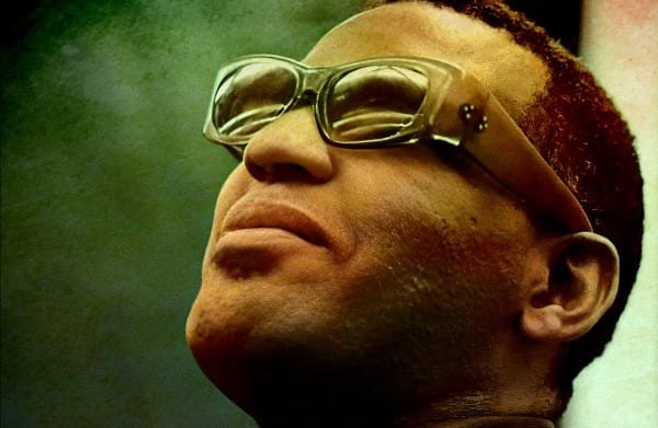 Vintage microphone and early electronic music equipment used by legendary artist during a historic live performance, capturing iconic moments in music history.