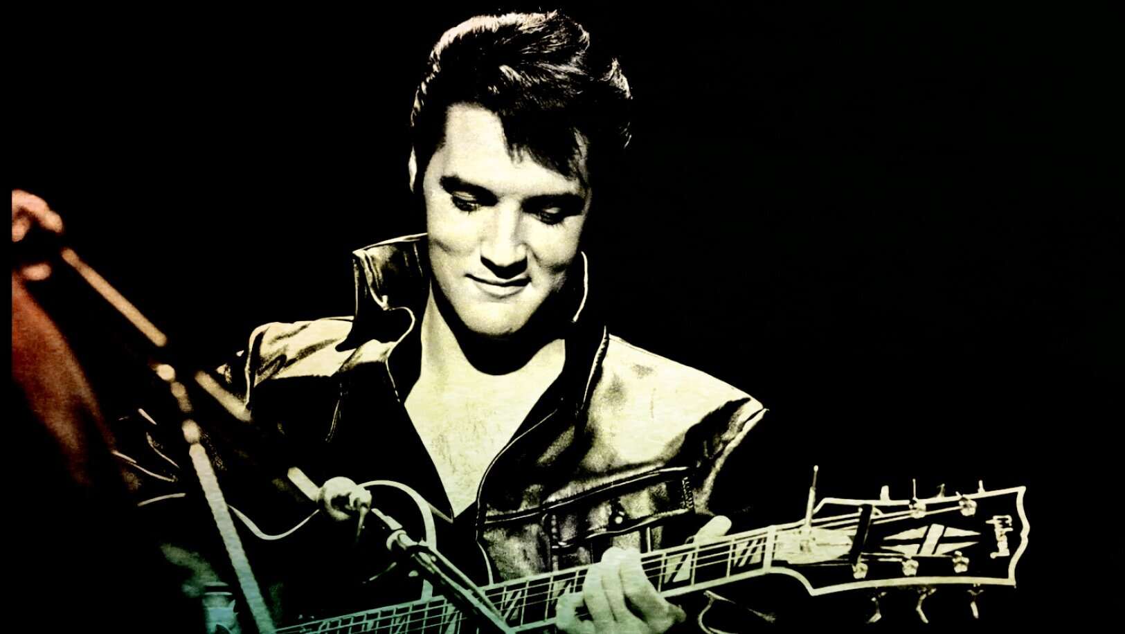 Guitarist performing on stage, black and white image emphasizing vintage music and entertainment themes, capturing the essence of music history and classic rock.