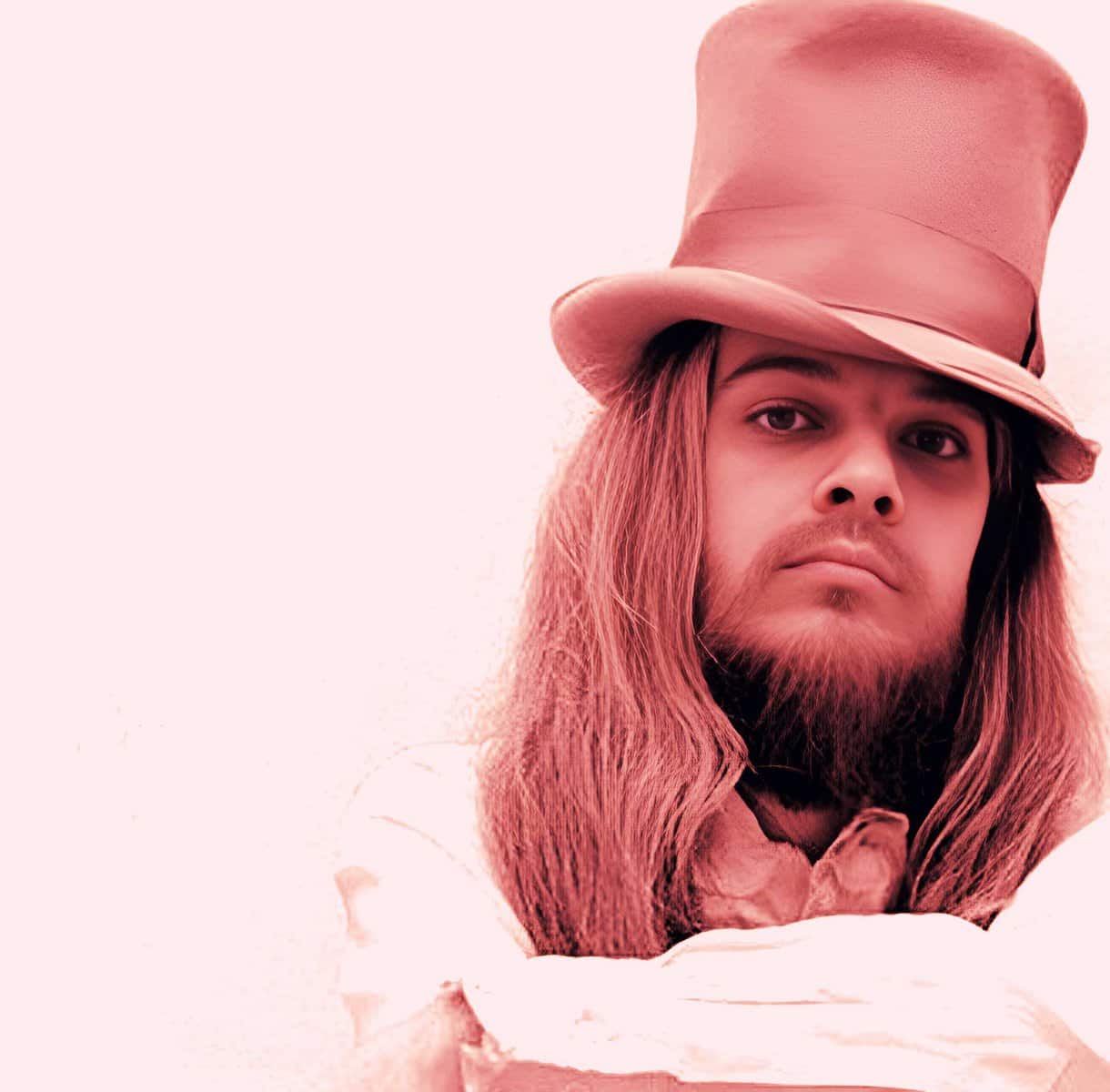Vintage music artist with long hair and a top hat, representing historical sound recordings and classic music archives.
