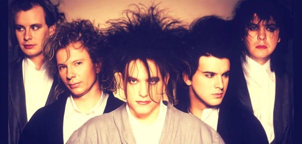 Iconic 1980s band The Cure with their signature punk and gothic style, showcasing influential music history and alternative rock.