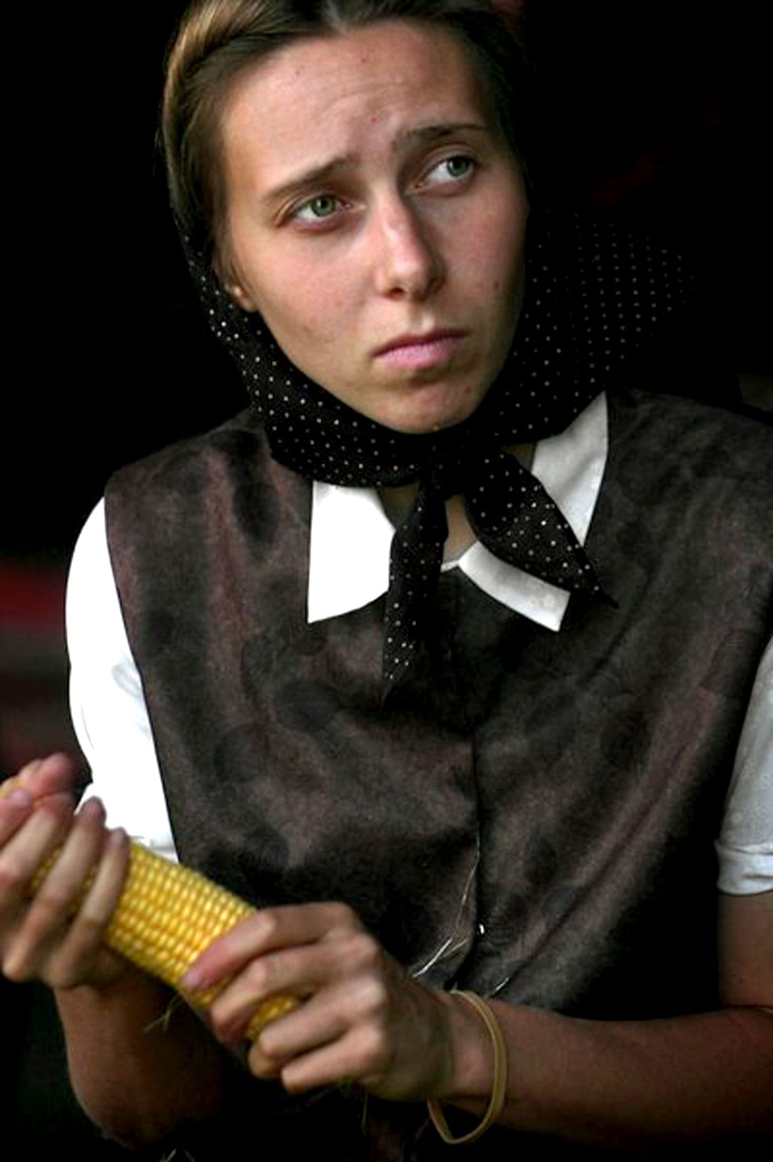 A Hutterite husking corn - the all-encompassing America is often at odds with itself.