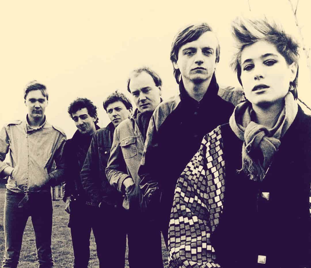 Vintage rock band portrait in black and white, emphasizing music history and iconic performers.