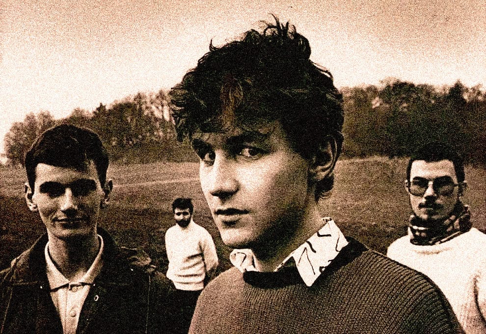 Vintage black and white photo of four young men outdoors, representing music, history, and cultural archives, suitable for Past Daily's sound archive of news, music, and historical recordings.