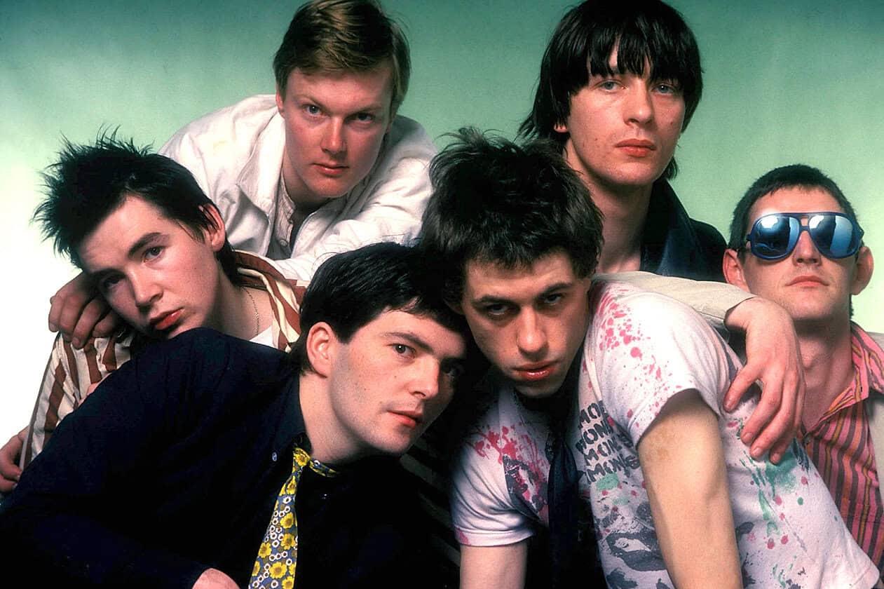 Vintage 90s British rock band Blur posing for a promotional photo, highlighting iconic music and cultural history.