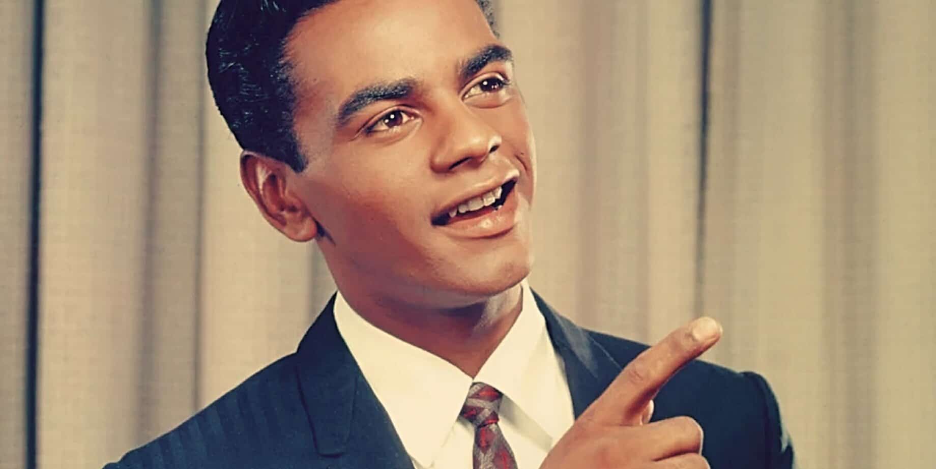 Vintage news reporter in a classic 1950s suit, smiling and pointing upwards, capturing the essence of historical journalism and media coverage.