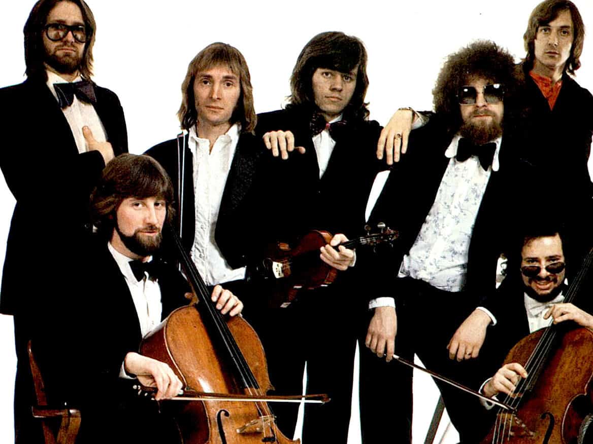 Vintage rock band photo featuring musicians with classical instruments, reflecting music history and iconic performances from the 1960s. Perfect for music history and sound archive content.