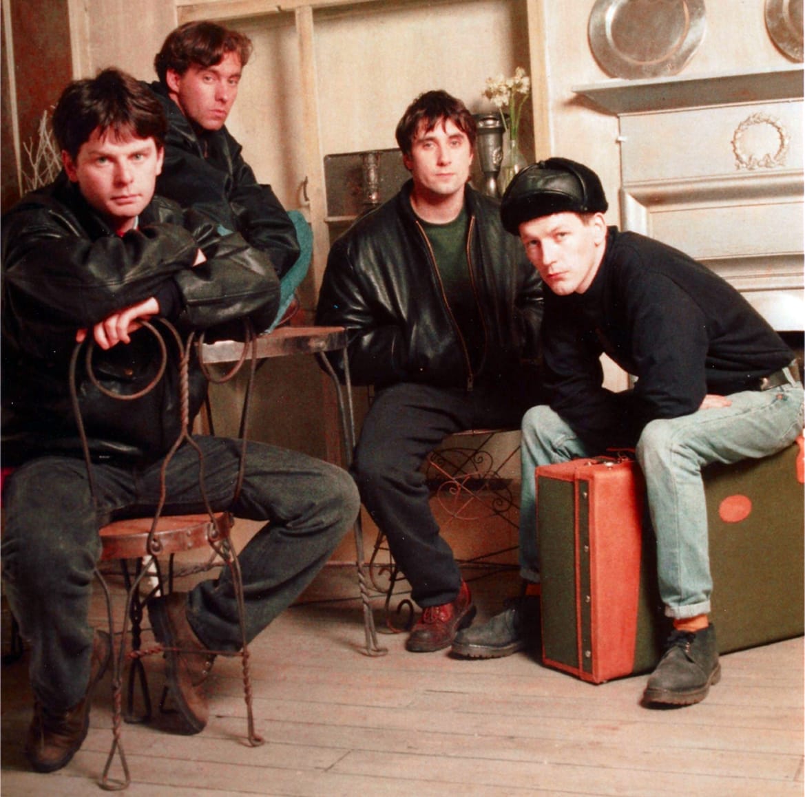 Challengers of the band, playing music in a cozy, vintage room setting, emphasizing rock band history, music nostalgia, and vintage style.