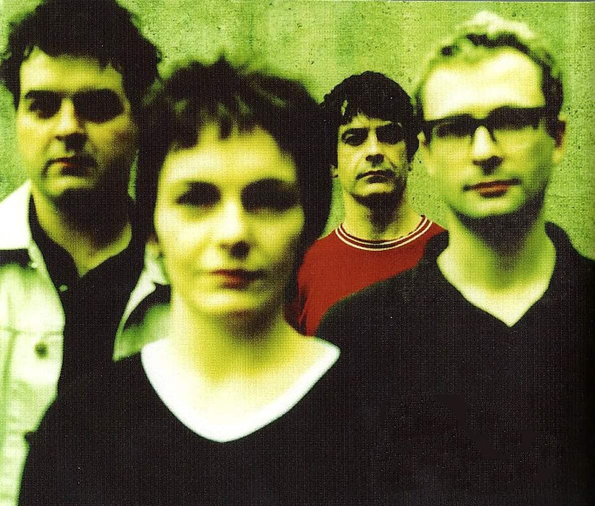 Vintage alternative rock band promotional photo, black and white image, music archive, historic music preservation, Past Daily news and music history.