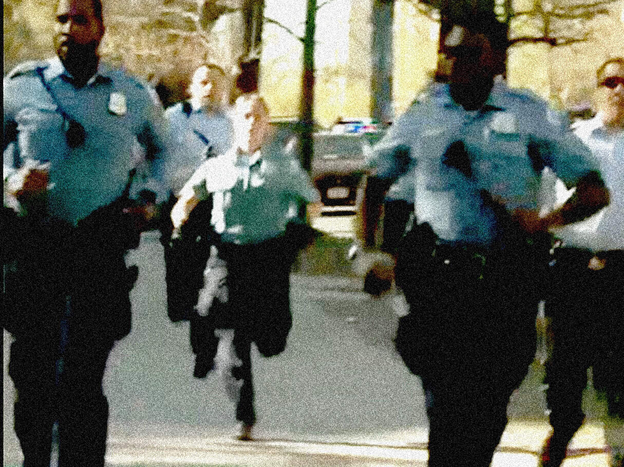 Police officers patrolling in an urban area, emphasizing law enforcement and public safety.