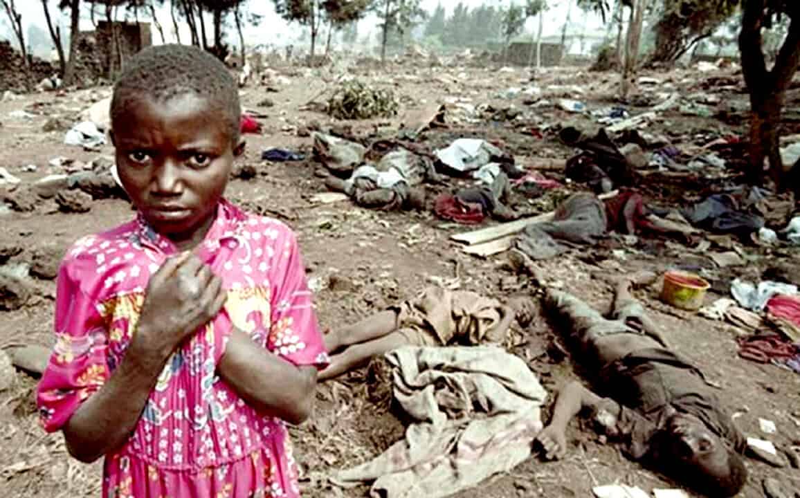 Child standing near mass casualties and dead bodies after disaster or conflict, emergency scene with children affected by tragedy, urban disaster impact, humanitarian crisis, humanitarian aid, and war zone.