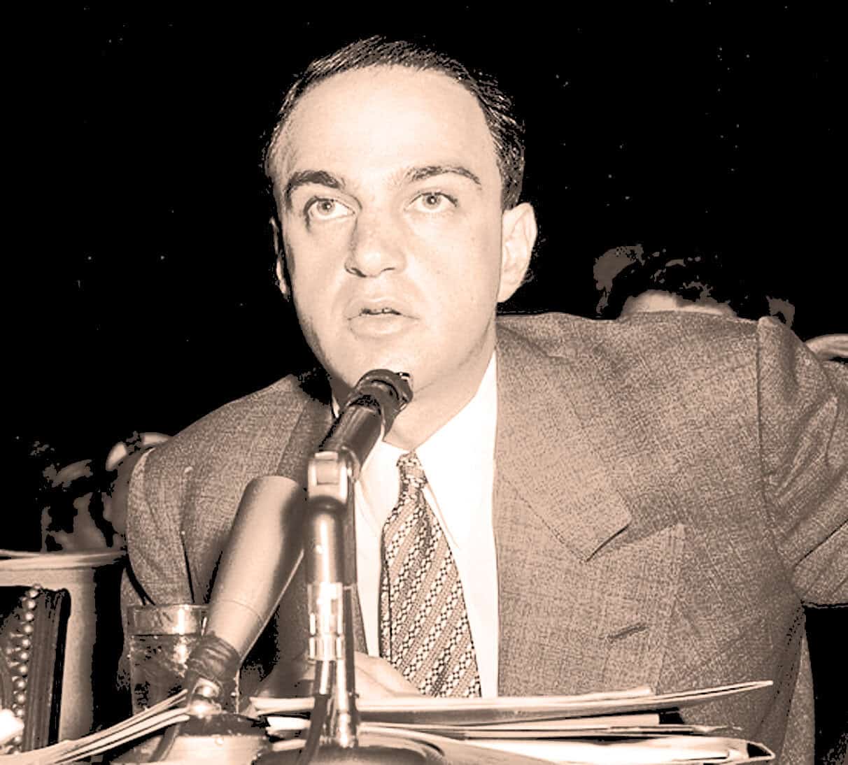 Voice of a man speaking into a microphone at a news or radio broadcast, historical news archive, media event, broadcast recording, news reporting, Past Daily sound archive, history and music preservation, vintage media, audio recording.