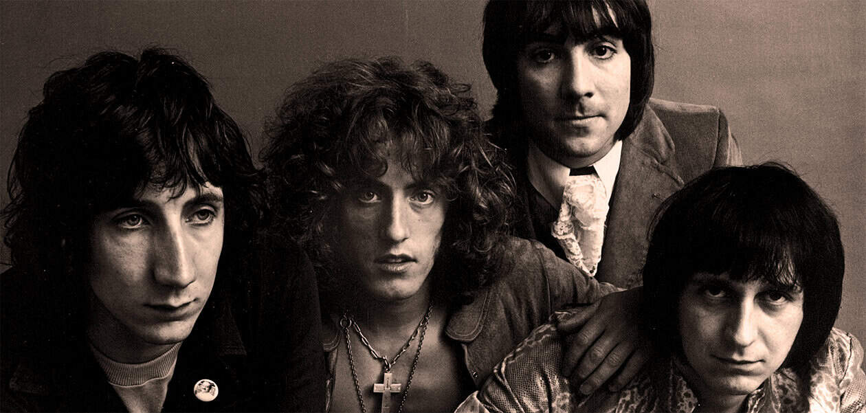 1970s rock band members, black and white photo, vintage music history, iconic music group image, classic rock era, Past Daily archive.