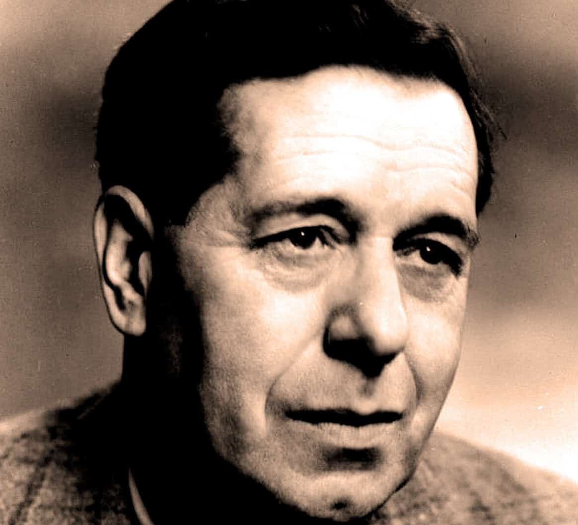 Historical black and white portrait of a man with dark hair, representing news, history, and music archive themes on Past Daily.