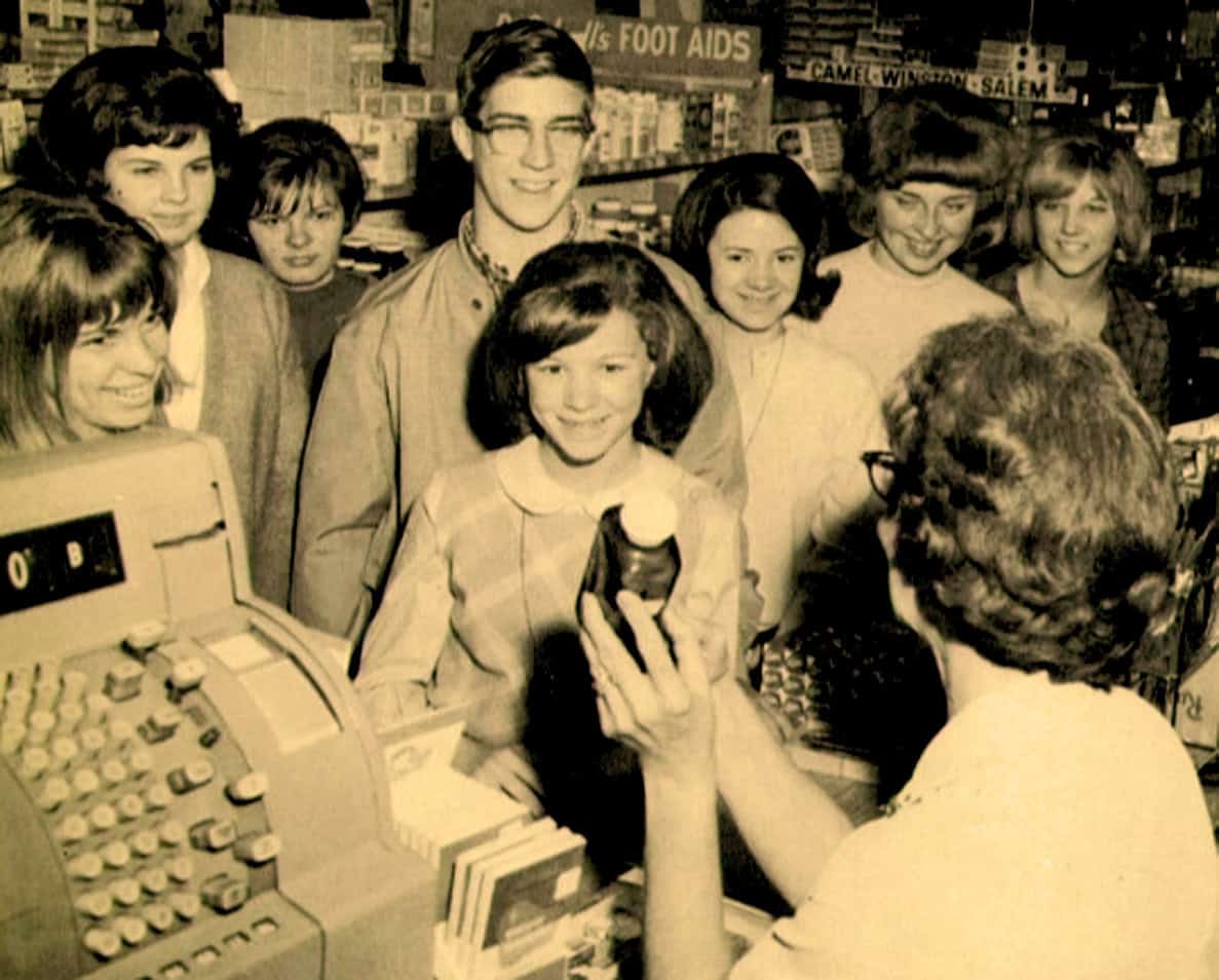 Children purchasing candy at a vintage store, nostalgic shopping scene, black and white photo, retro retail environment, past daily news archive, historical music and news memorabilia, vintage community atmosphere, old-fashioned shopping experience.