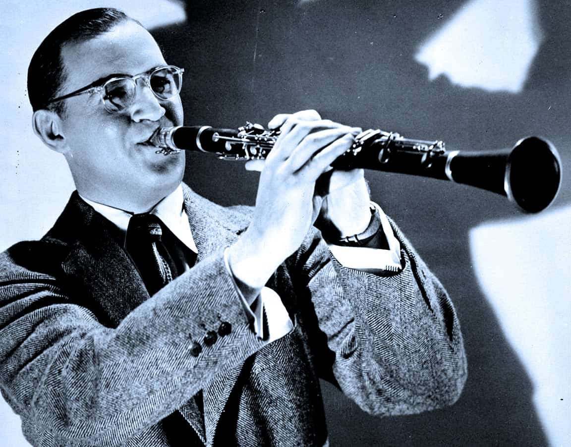 Vintage black and white photo of a man playing a clarinet, showcasing jazz and music history.