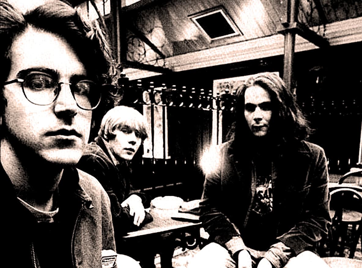 Young women in a vintage diner, black and white photo, indie music scene, performance, retro vibe, Past Daily archive.