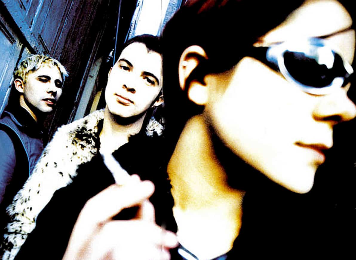 Stylish young women with sunglasses, urban background, music fans, contemporary pop culture, photo by Past Daily: A Sound Archive of News, History, and Music.