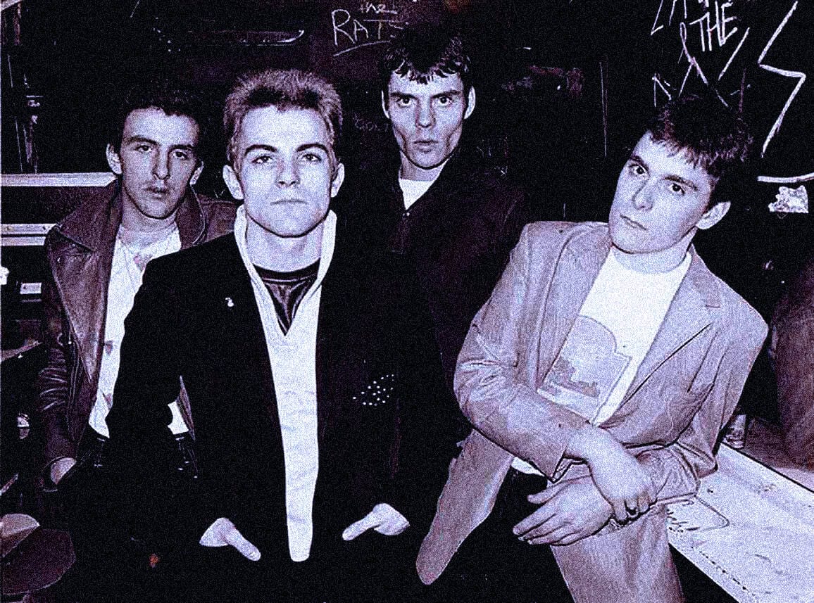 Vintage black-and-white photo of The Ramones punk rock band in a music studio, showcasing iconic band members with a grunge aesthetic. Perfect for music history and punk rock archives.