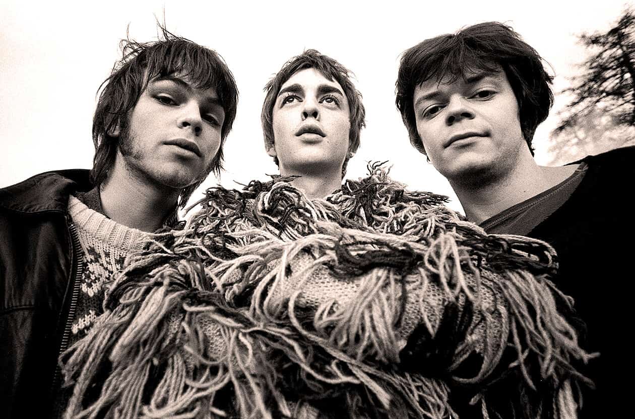 Shot of a vintage rock band members with a creative scarf design, representing classic music and news history themes, suitable for the Past Daily sound archive website.