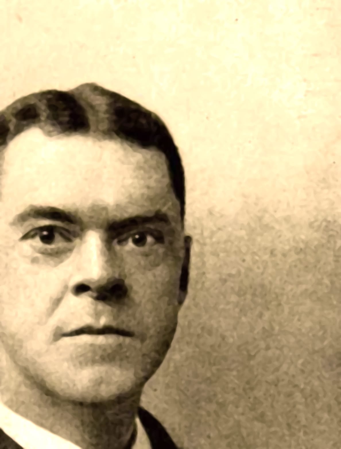 Vintage black and white portrait of a young man with a serious expression, illustrating historical news and music archives from pastdaily.com, highlighting the significance of audio history preservation.