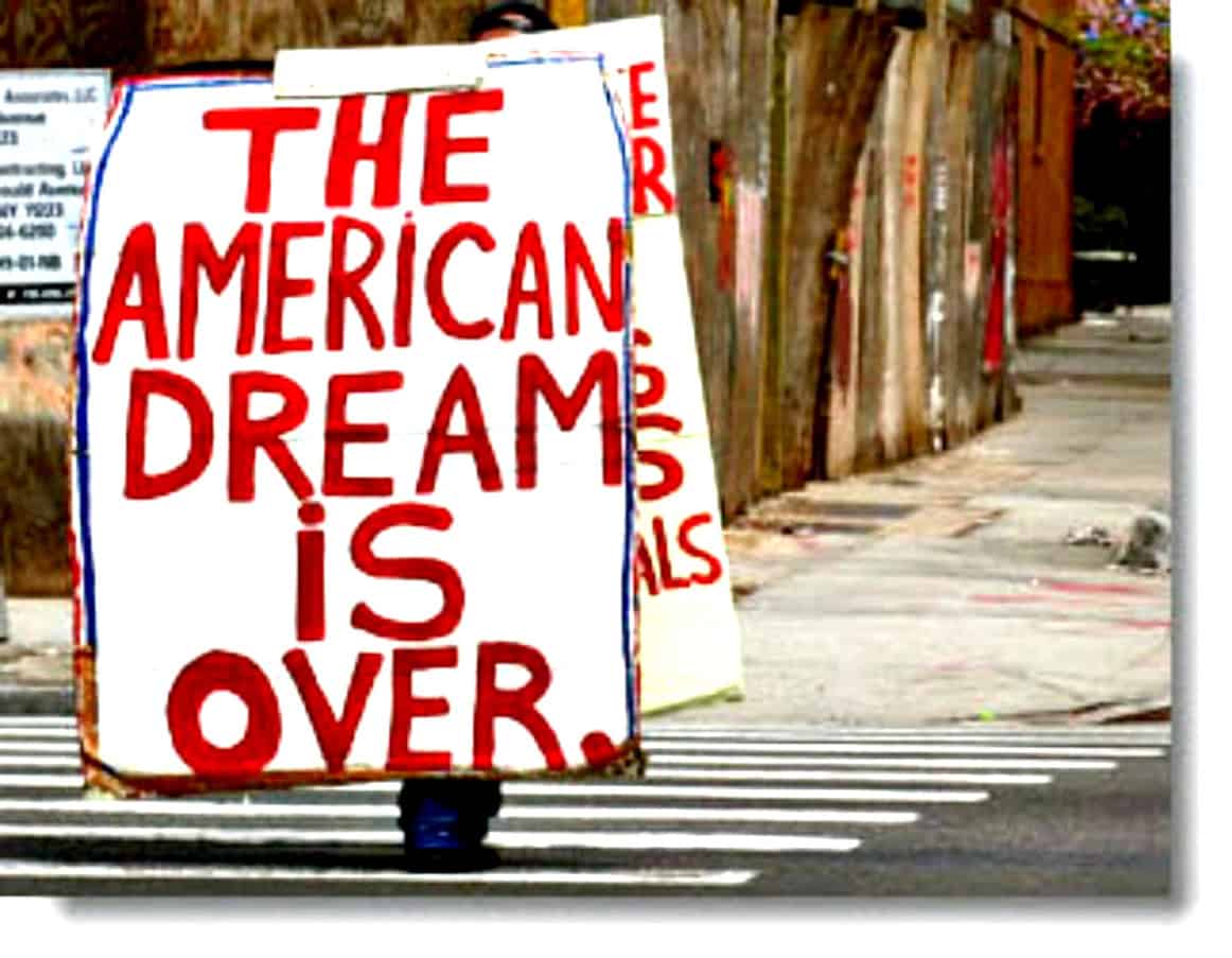Freedom and hope rally sign on city street with painted message celebrating the end of the American Dream.
