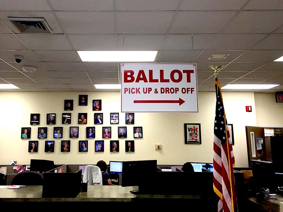 Ballot pick up and drop off station at an election voting site, voting process, election polling station, democratic process, American election voting booth, vote sign, election day in the United States, voting system.