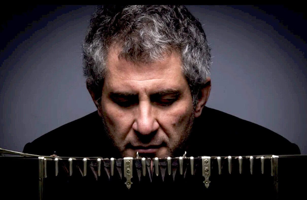 Guy playing vibraphone music, jazz musician, close-up of man concentrating on musical instrument, jazz, music news, historic music archive, news and culture photography, Past Daily sound archive relevance.