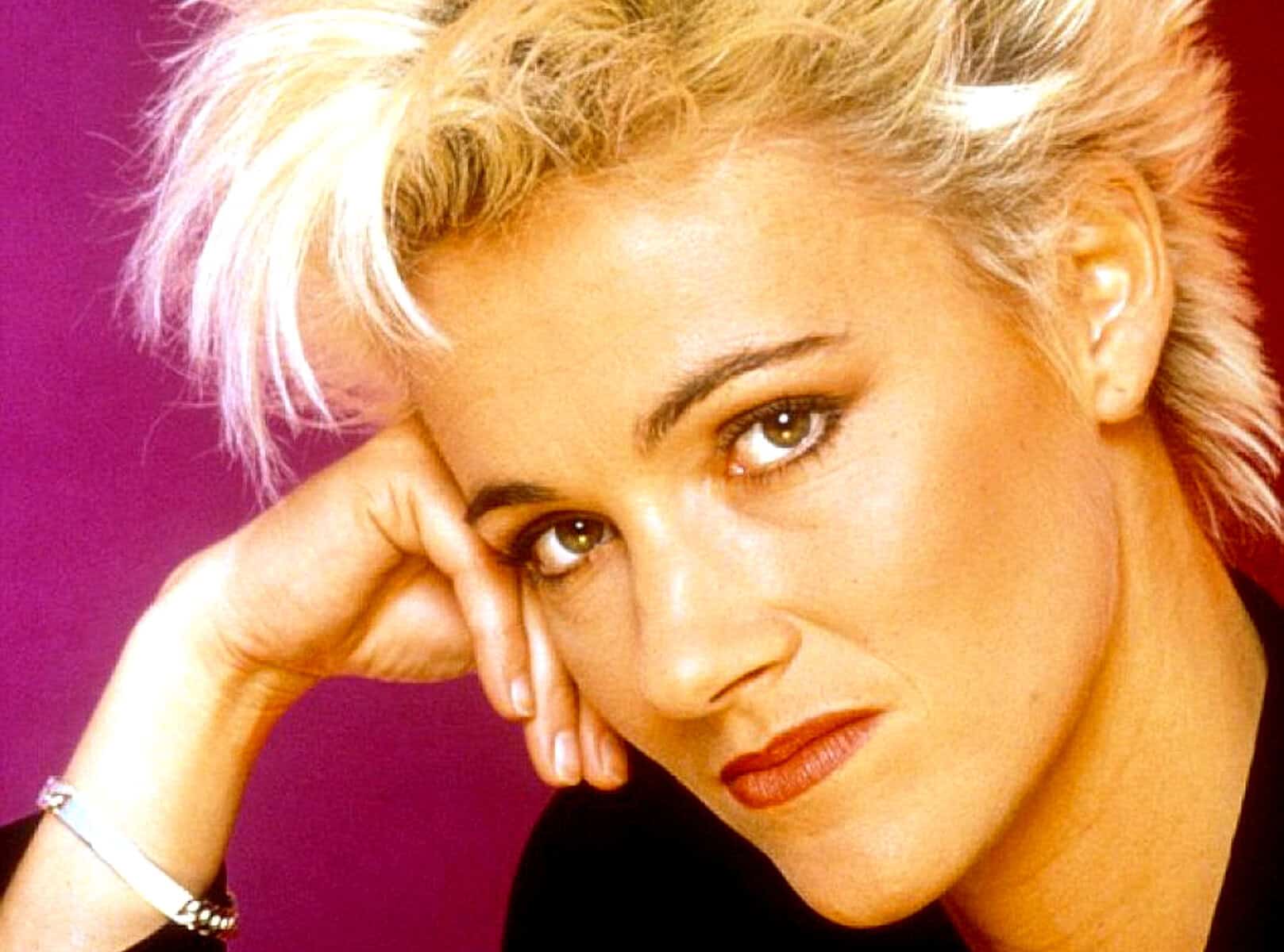 Blonde woman with styled hair and striking eyes, representing news, history, and music archives; digital image for Past Daily sound archive website.