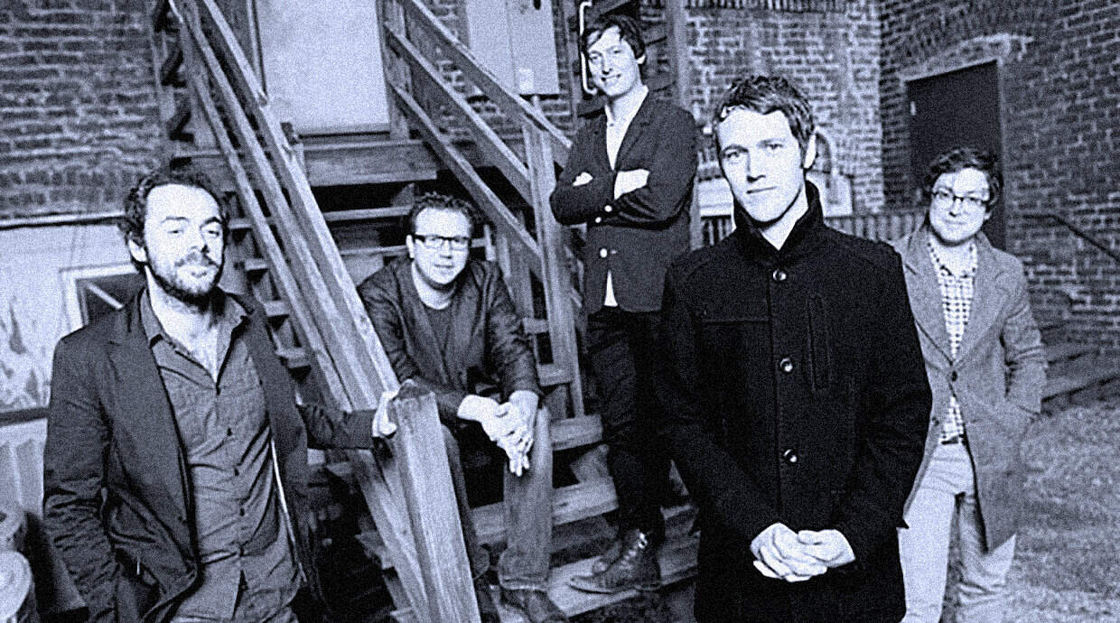 Past daily sound archive news history music group outdoor staircase urban setting black and white image.