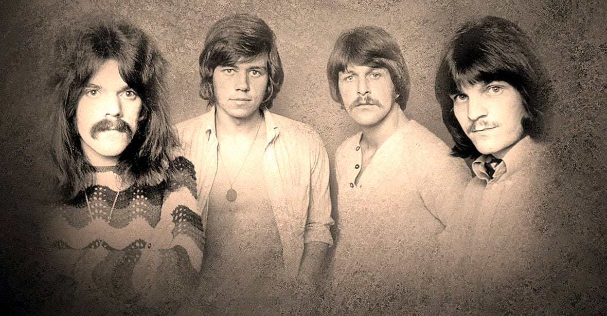 Rock band The Beatles, vintage black and white portrait, classic music history, 1960s rock music, iconic British band, music archive, band members with 60s hairstyles, legendary music group, historic music photograph, nostalgic music era relevance.