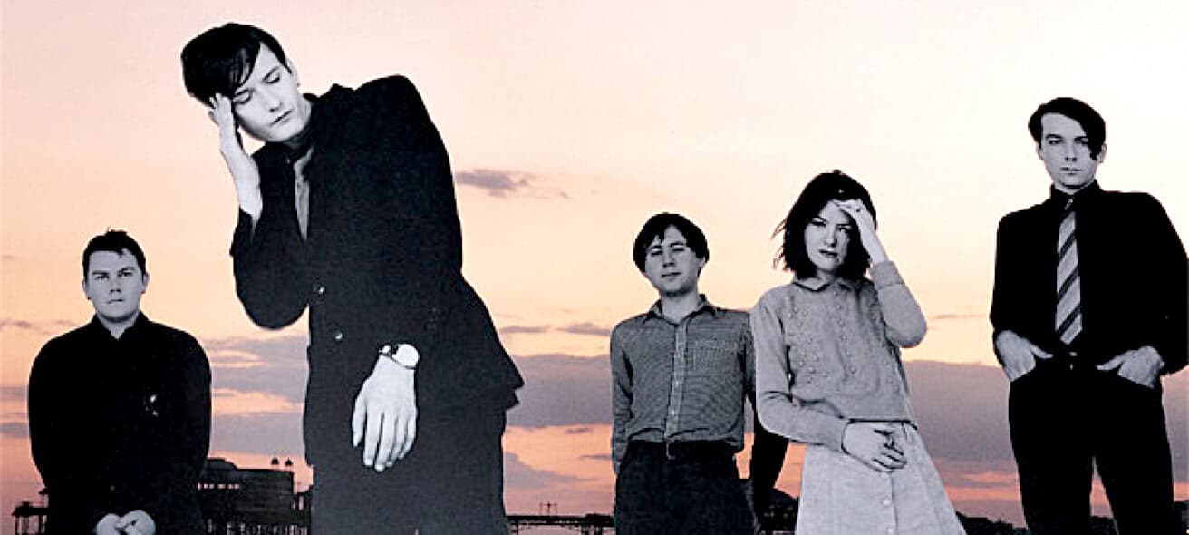 Vintage band photo at sunset, showcasing music archive themes and historical moments, perfect for music history and news archive websites.