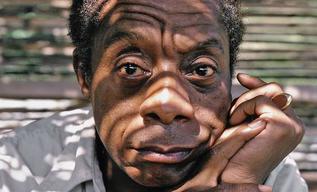 Close-up of an elderly man with expressive facial features, deep-set eyes, and textured skin, highlighting human emotion and character.