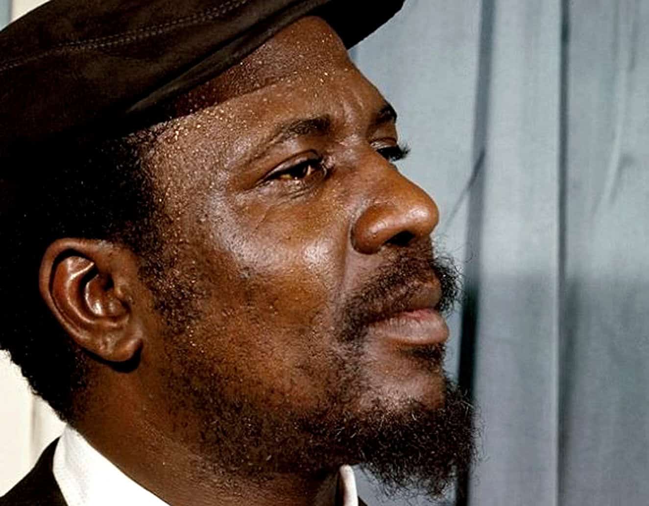 Portrait of a musician with a traditional headwrap, celebrating musical history and cultural heritage in a historic news and music archive context, highlighting vintage and cultural themes for SEO.