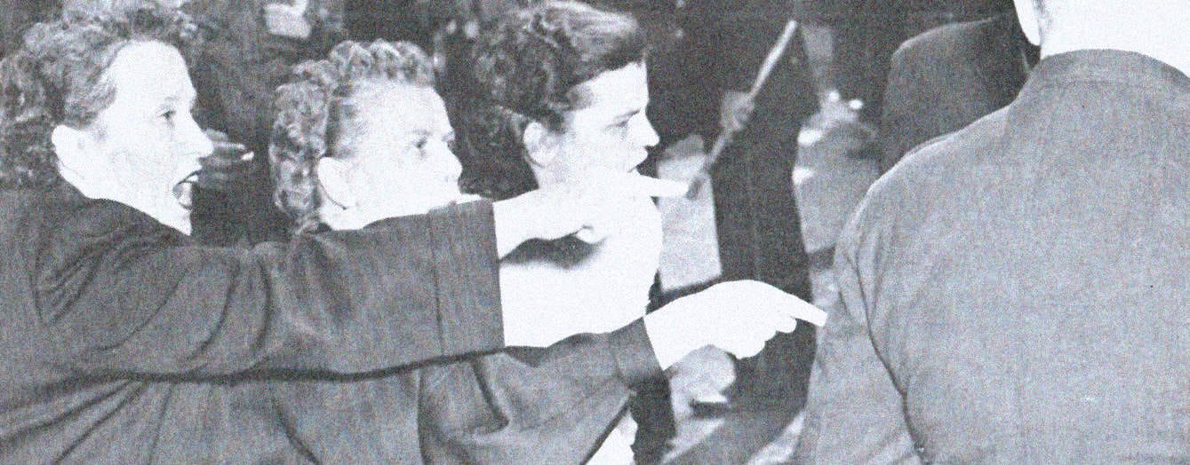 Women protesting during a historical demonstration, highlighting activism and social movements.