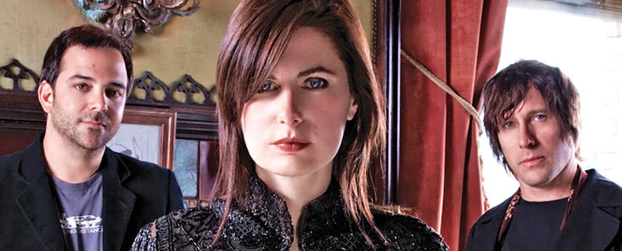 Vintage rock band photo showcasing dynamic musicianship and style, highlighting the connection between music, history, and cultural archives. Perfect for promoting historical music recordings and news archives.