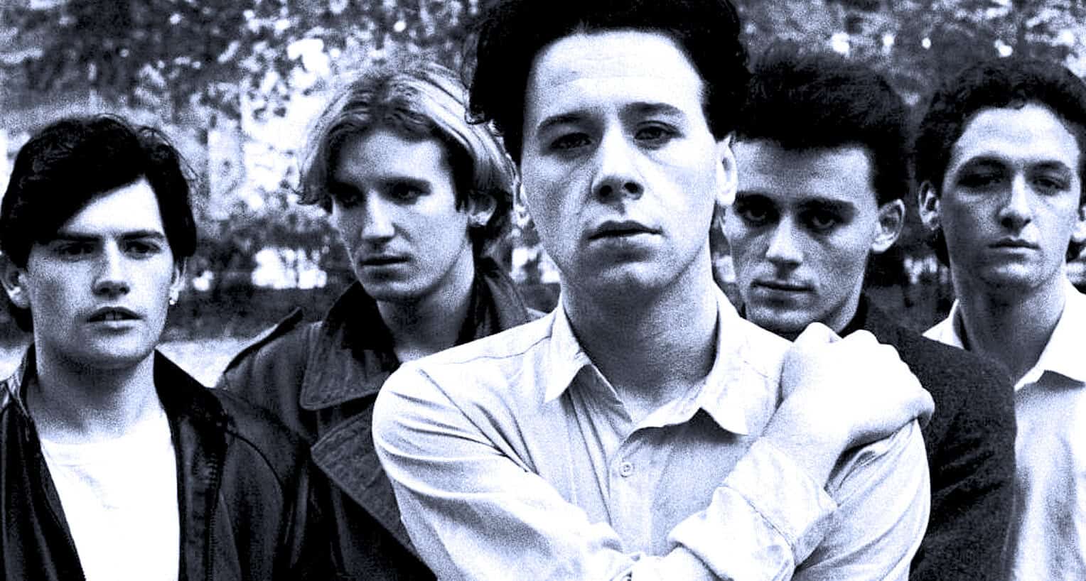 Spectacular black and white photo of The Drifters, a legendary rock band, showcasing their timeless style and influence in music history, captured outdoors.