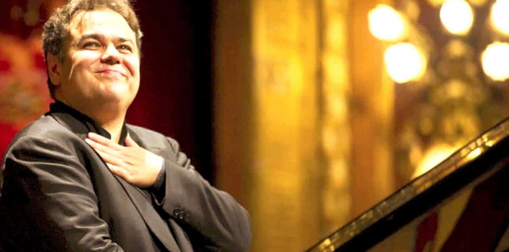 A Sound Archive of News, History, and Music featuring a pianist at a historic concert venue, emphasizing classic music, live performances, and archival media.