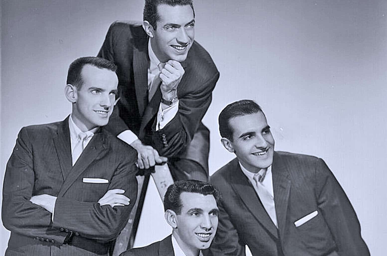 Vintage black and white photograph of a 1950s vocal group dressed in suits, highlighting classic music history and archive news content related to mid-20th-century entertainment.