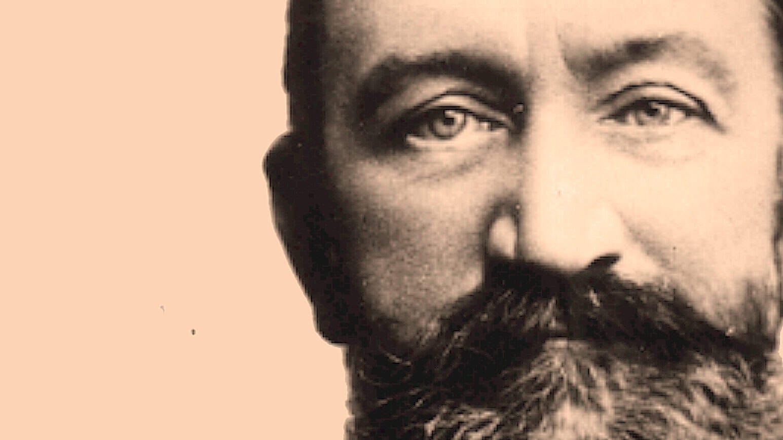 Close-up portrait of a man with a beard and expressive eyes, highlighting historical figures in news, history, and music archives; black and white photo emphasizing timelessness.