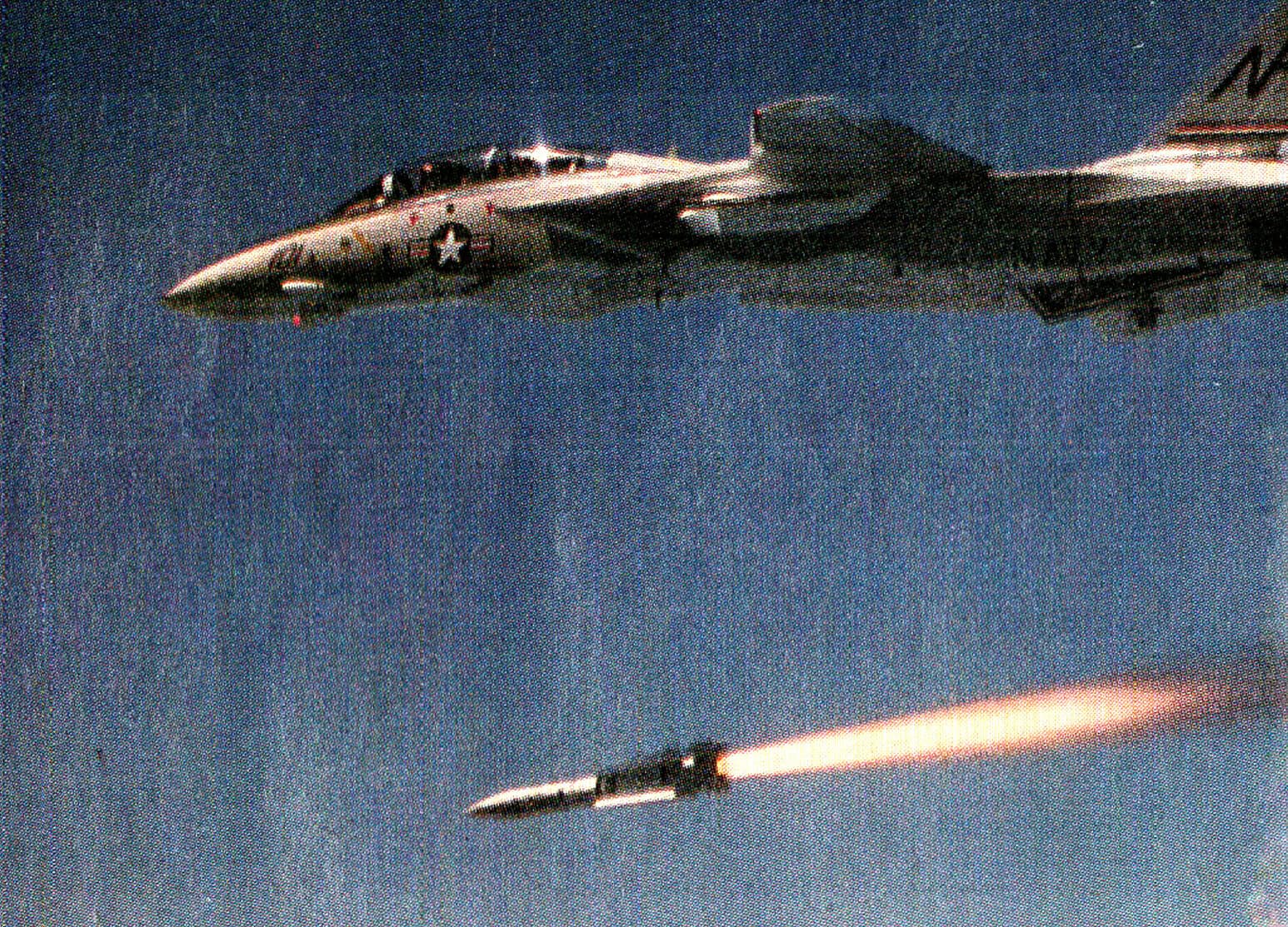 F-4 Phantom II military jet launching a missile against a blue sky background, showcasing aircraft weaponry and fighter jet technology, part of historic military aviation archives.