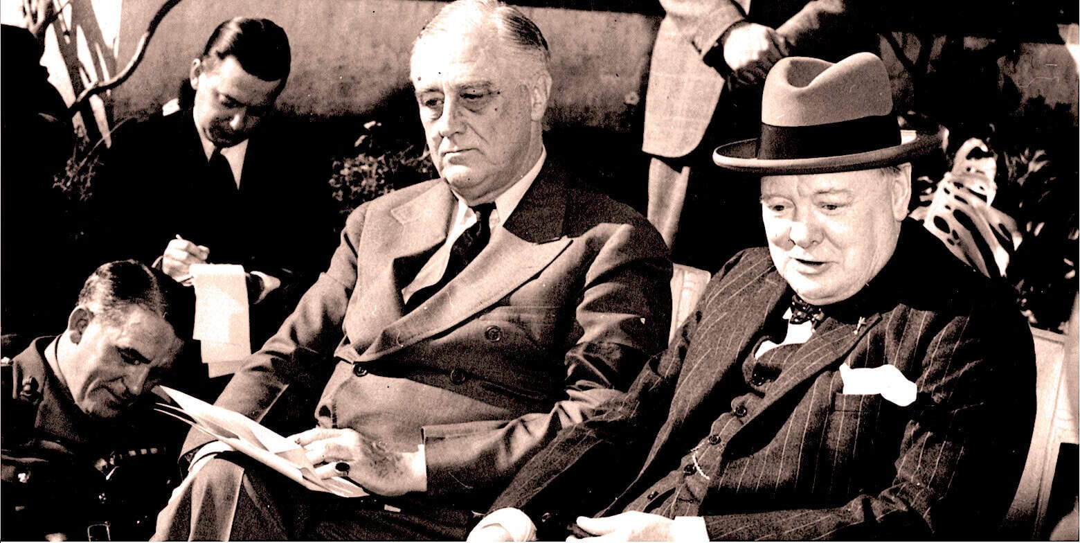 Photograph of vintage news and history figures at a 20th-century gathering, capturing a moment of discussion among influential personalities, reflecting the aesthetic of classic media archives.