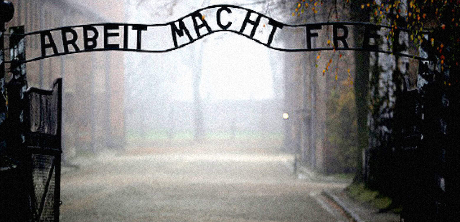 Germany, Holocaust, Nazi death camp, Auschwitz, memorial site, historical tragedy, World War II, remembrance, concentration camp gate, dark and foggy atmosphere, historical landmark, remembrances of genocide, past daily archive collection, historical photo, Germany history, education on Holocaust, memorial architecture, somber mood, historical preservation, Holocaust education.