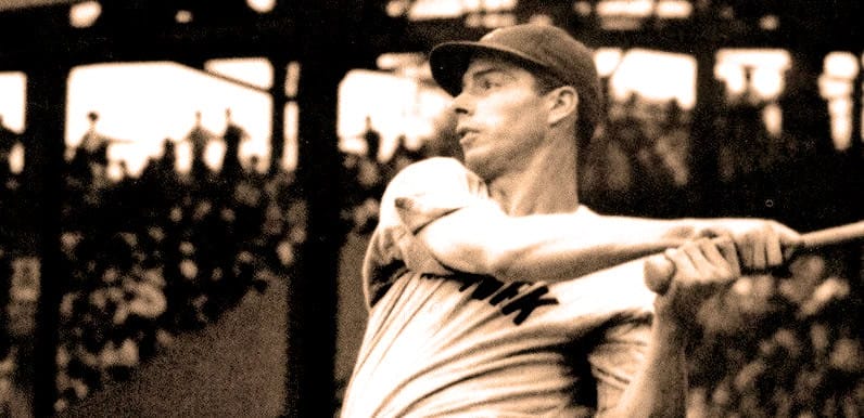 Vintage black and white photo of a man playing baseball, capturing historic sports moments.