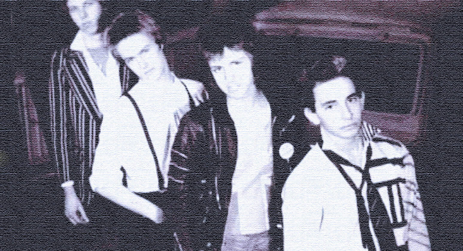 Vintage black and white photo of a band with four members, showcasing classic rock style, album art, and music history. Perfect for music archives and historical music content.