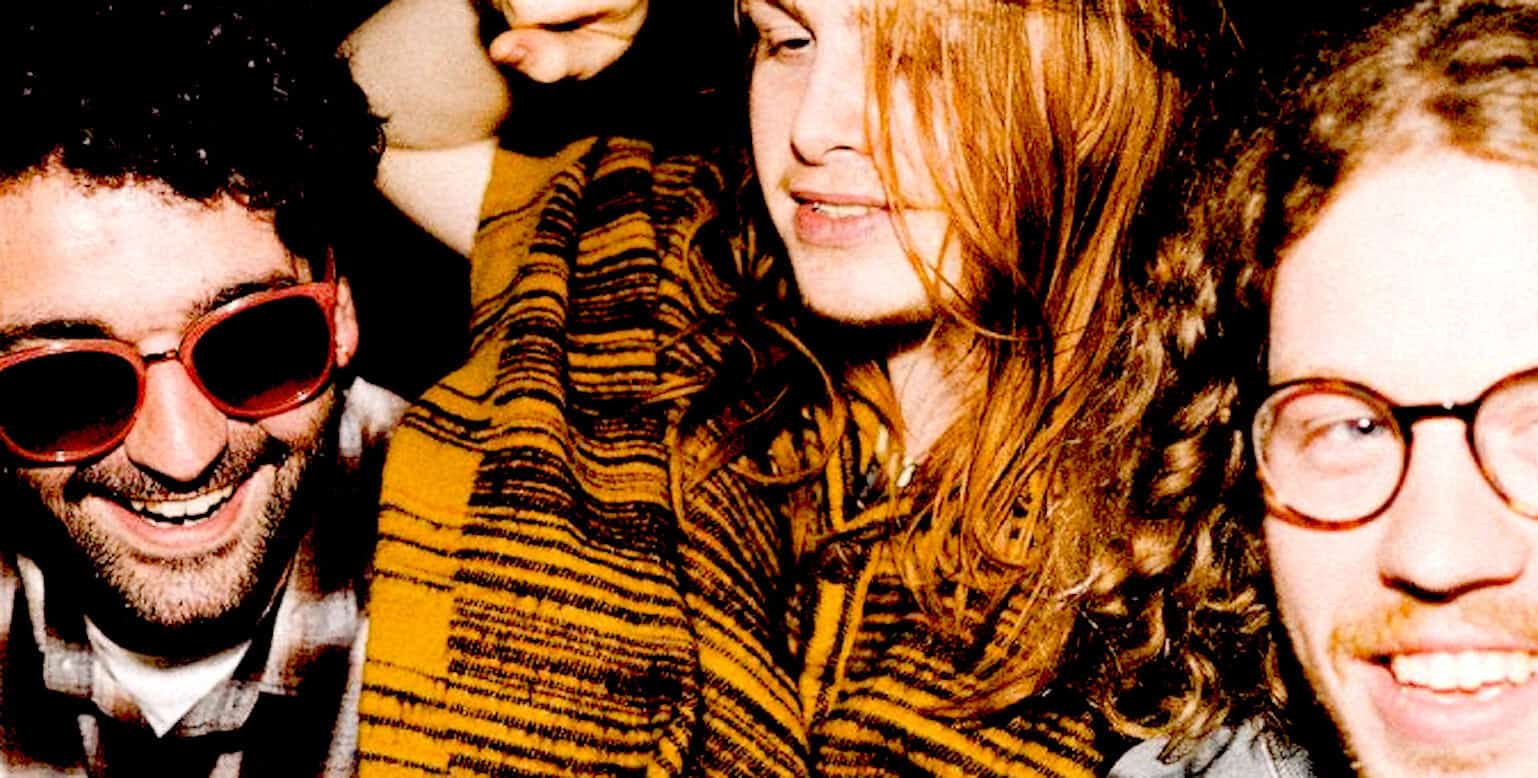 Happy group of young people enjoying music and socializing, representing a lively atmosphere for music and cultural history; inspired by Past Daily's archive of news, history, and music.