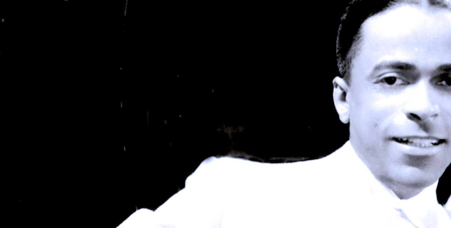 Vintage black and white photograph of a young woman, featuring historical attire, capturing a moment in news, history, and music archives for archival and educational purposes.