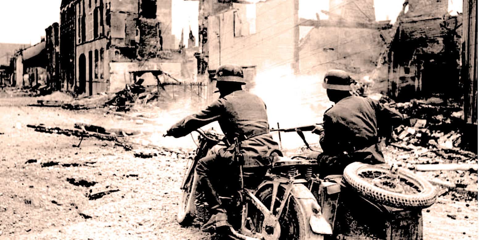 Burned urban street scene with soldiers riding a motorcycle through wartime destruction, reflecting historical wartime scenes, news archives, and historical photographs.
