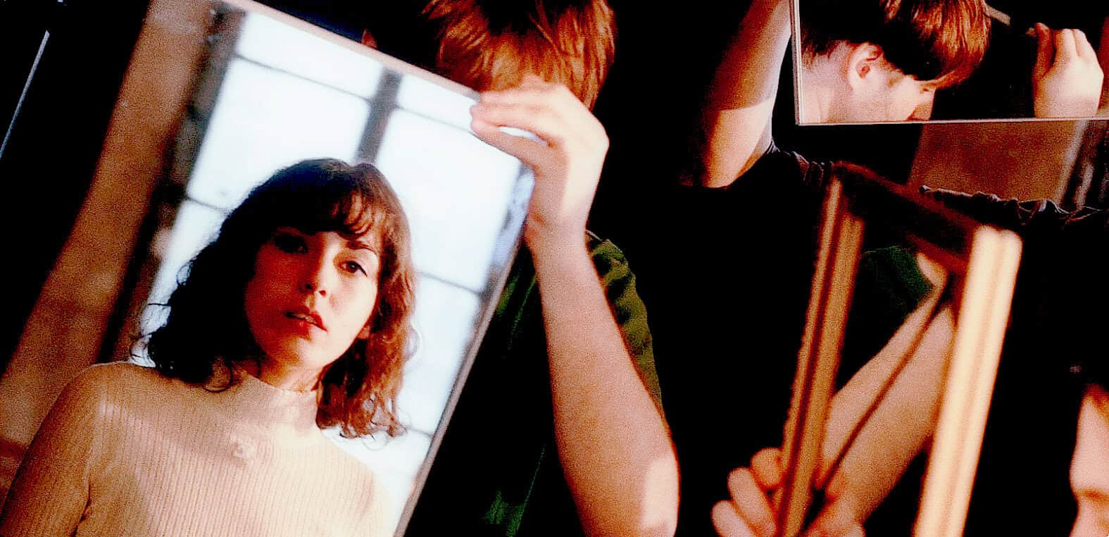 Teen girl taking selfies with mirrors for social media, young woman capturing herself on multiple smartphones, modern digital photography, vibrant lifestyle scene.