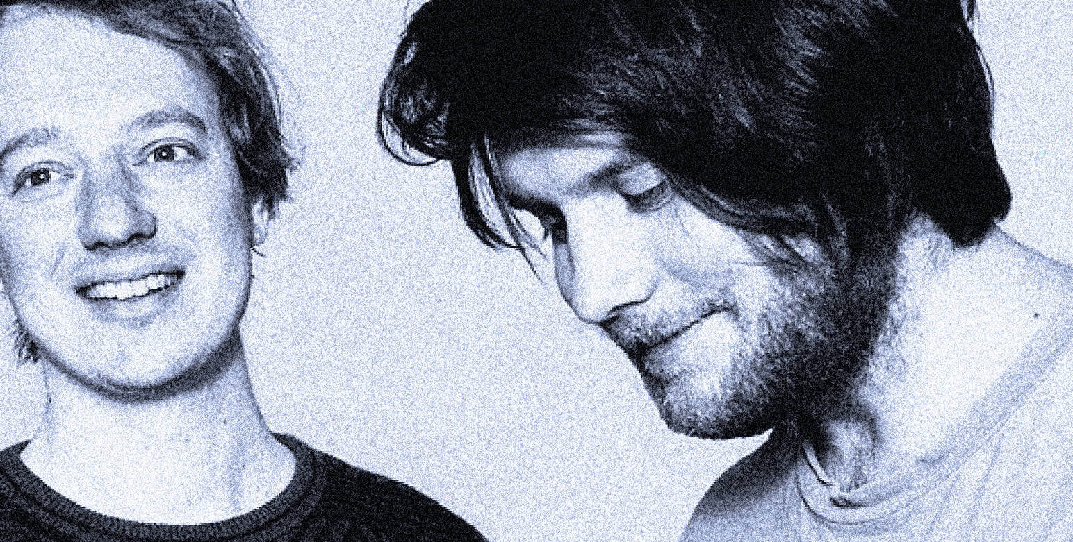 Young man with glasses smiling, black and white photo representing music, news, and history archives on Past Daily website.